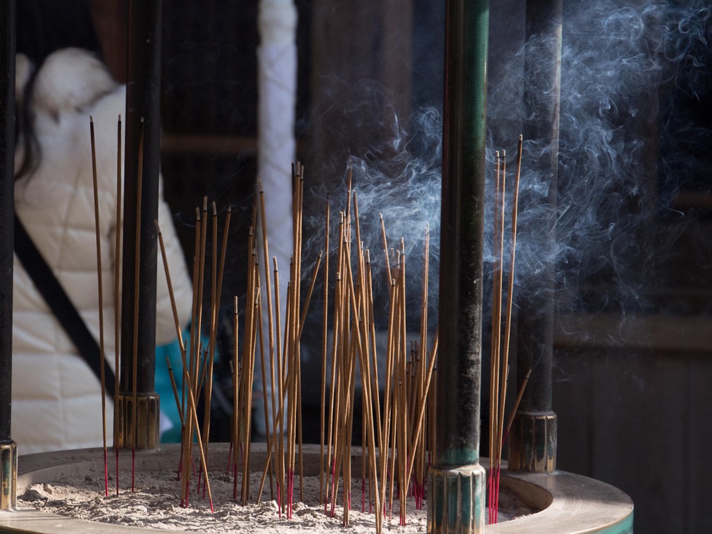 Incense set by visitors at a shrine in Kyoto