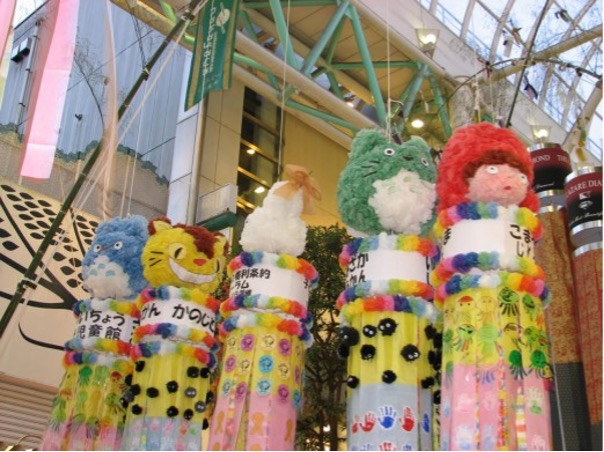 Large Totoro figurines hang above a shopping mall in Sendai, Japan.