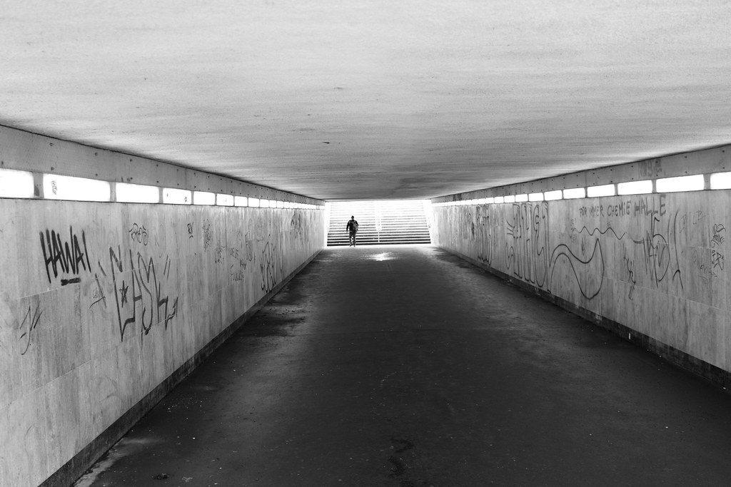 A black and white photo of a grafitti-covered underpass in Leipzig, Germany