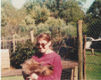 Kym with a wombat on a school band trip to Tasmania in 1993